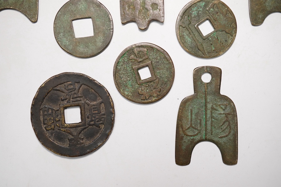 A group of Chinese replica spade coins, a Wu Zhu coin, and others